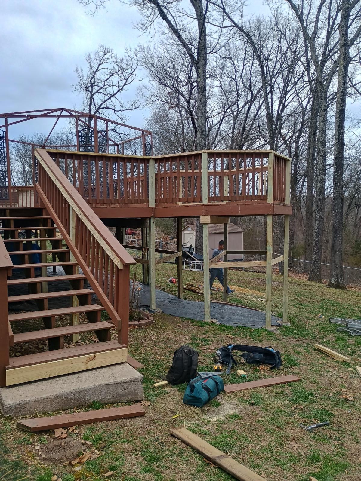 Wood deck with stairs and railing